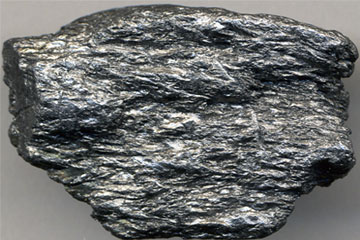 Randomly stacked graphene layers approach the theoretical performance of graphite